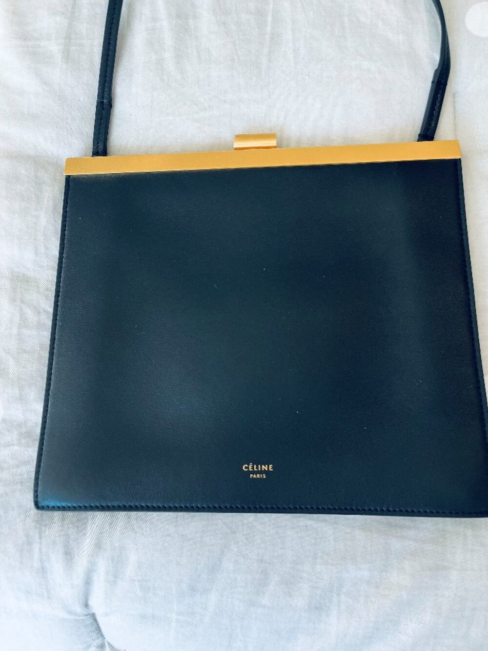 Elegant slim black handbag made in Paris by Celine with gold closure